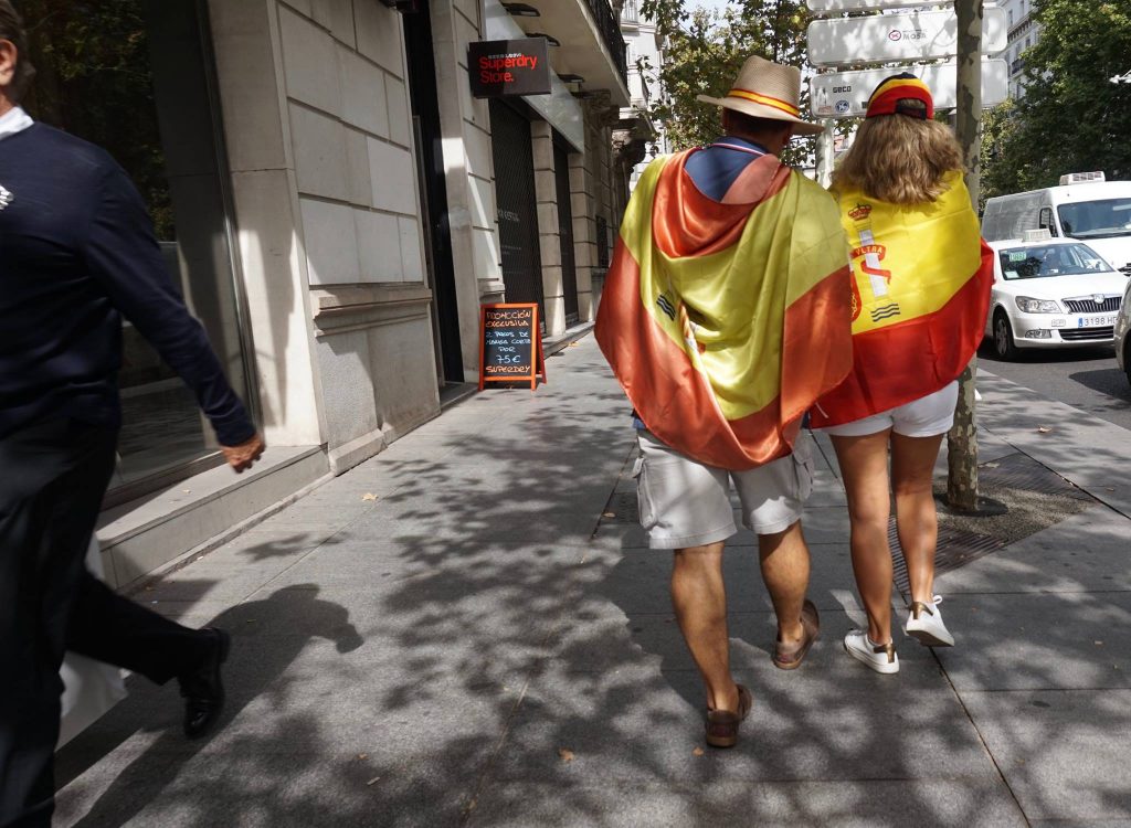 protestors with spanish flags in madrid